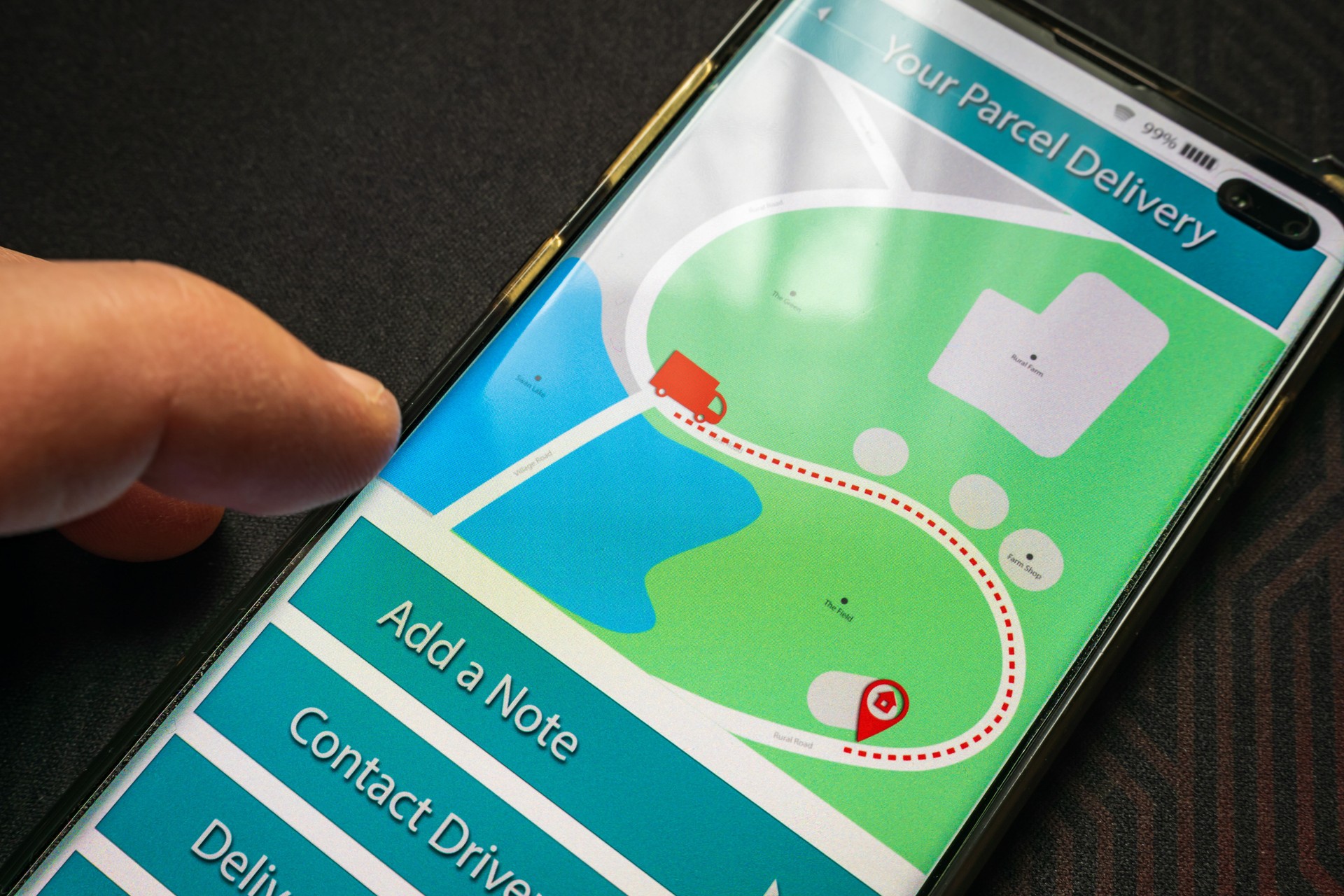 Male thumb finger over parcel delivery app on smartphone screen