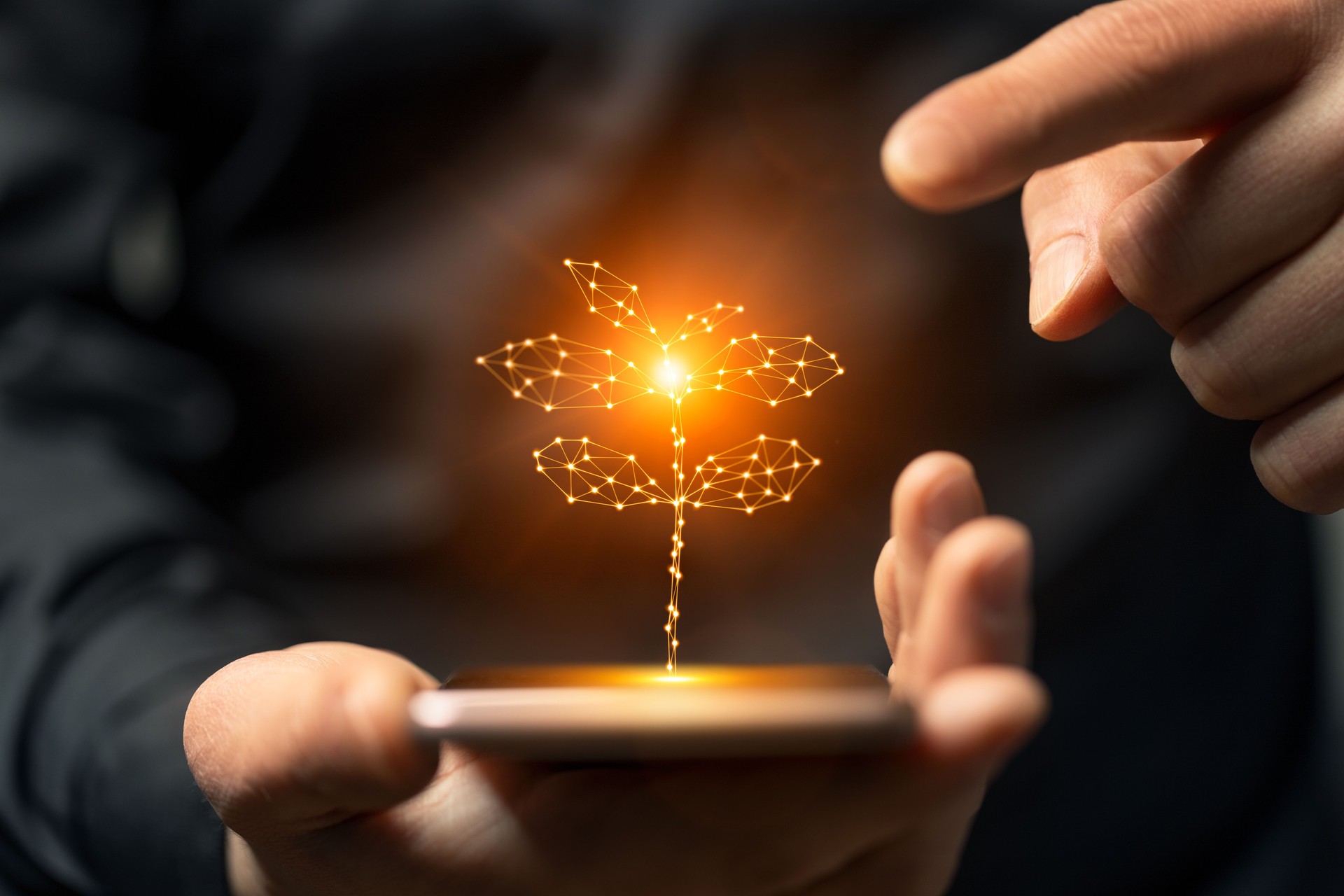 Artificial intelligence new life plant symbol on smartphone in hand.